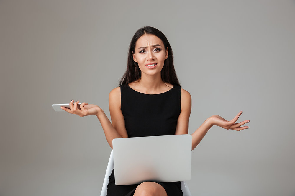 Frustrated person filling out long car insurance form and feeling overwhelmed by high costs